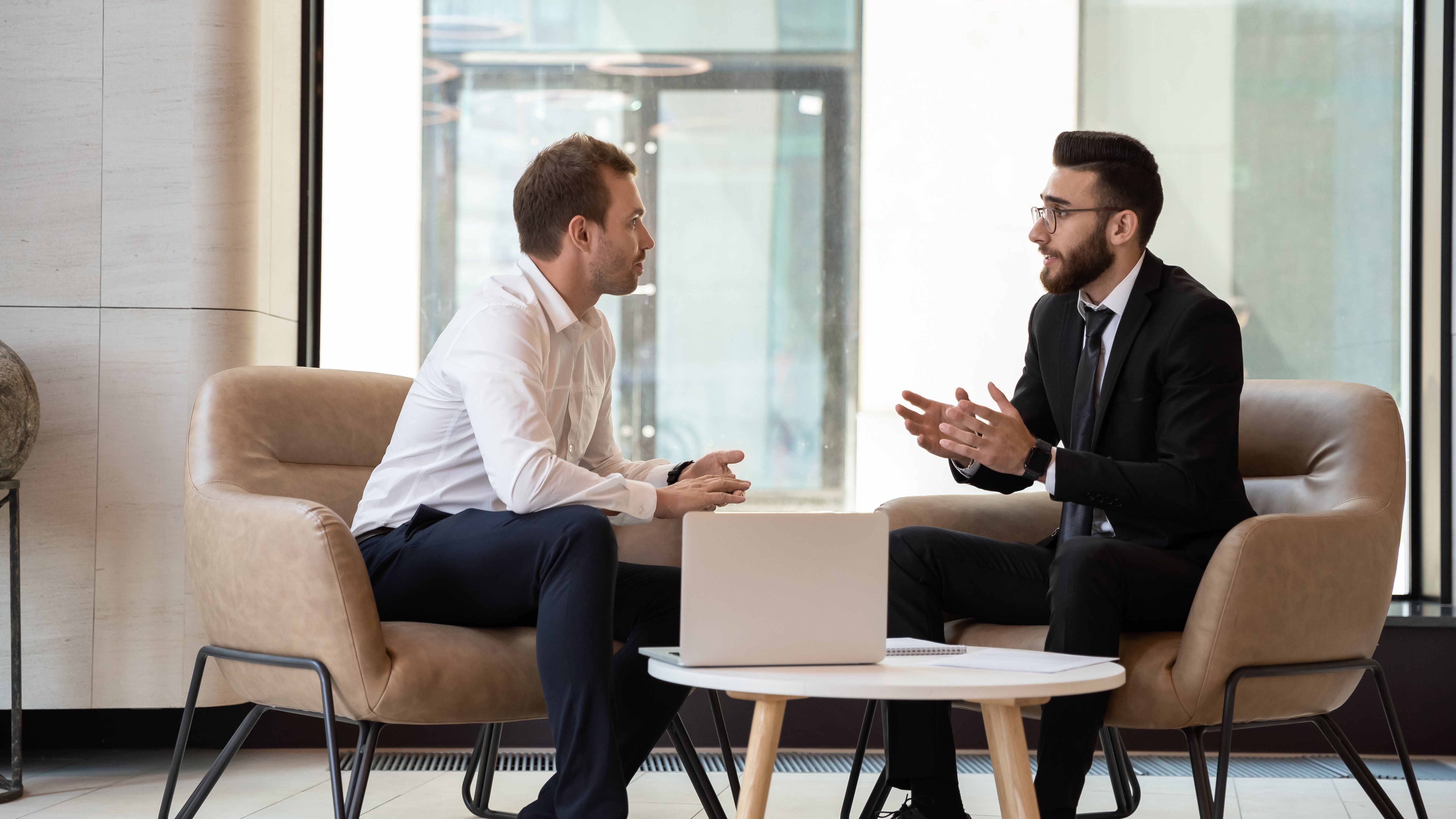 instructor in a suit providing negotiation training