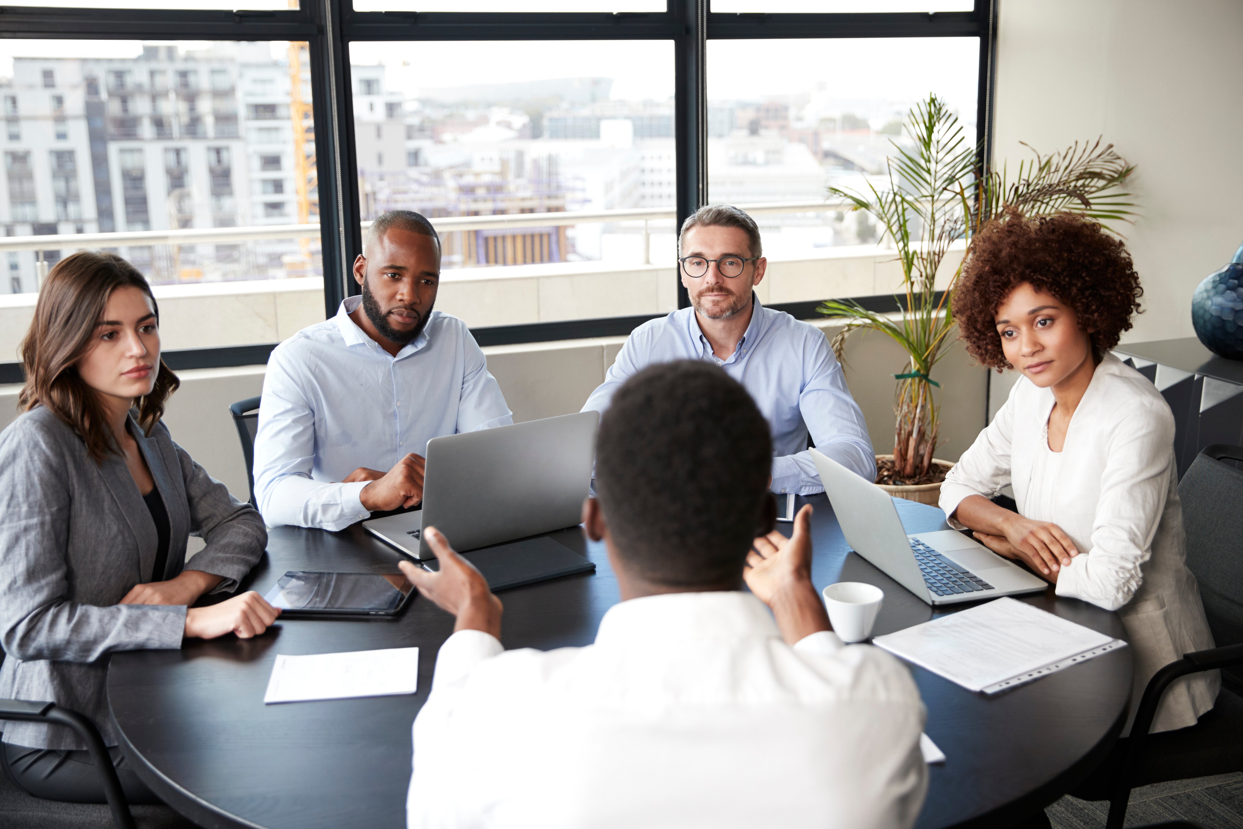 Group of people negotiating terms for a new contract 