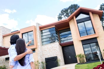 Couple looking at a beautiful house to buy.jpeg