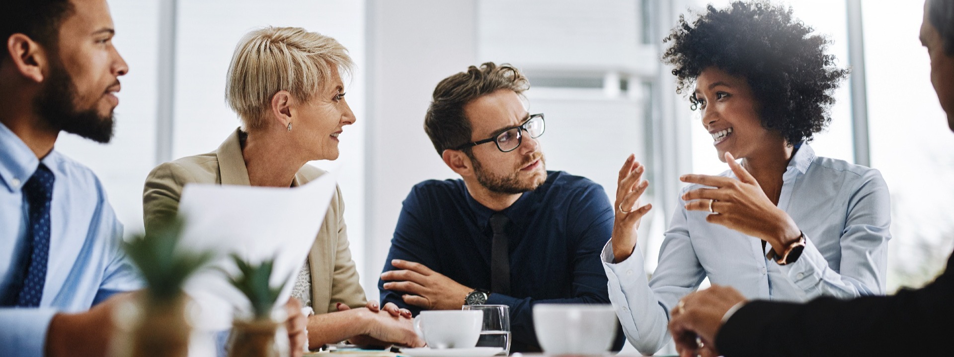 A group of business people discussing contract pricing.