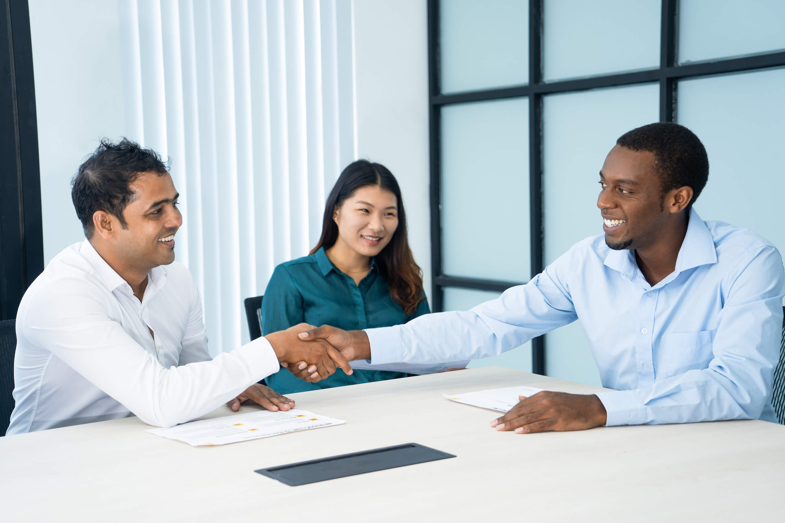 Shaking hands during a meeting